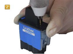 Brother LC-900 drilling a filler opening