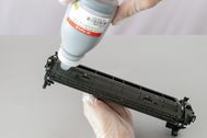 Refill toner with screw funnel